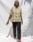 The model is wearing blue, orange, green, brown, white and black print shirt