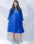 The model is wearing blue dress