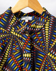 Display of  multi-colored abstract print dress