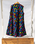 Display of black dress with colorful panel