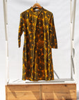 Display of black, yellow print dress