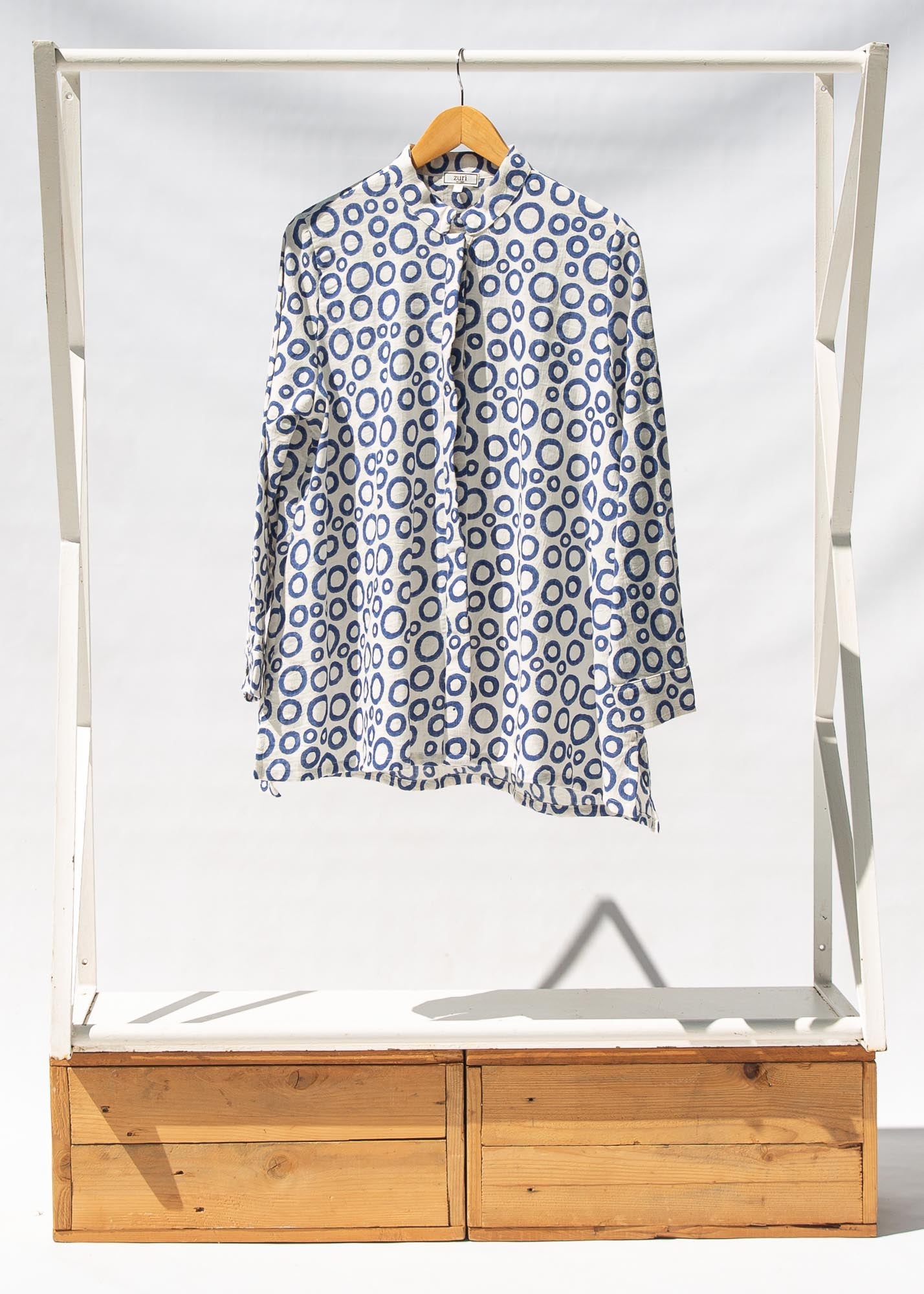 Display of white, blue print shirt