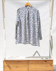 Display of white, blue print shirt