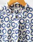 Display of white, blue print shirt