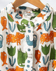 Display of blue, orange, green, brown, white and black print shirt