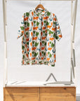 Display of blue, orange, green, brown, white and black print shirt