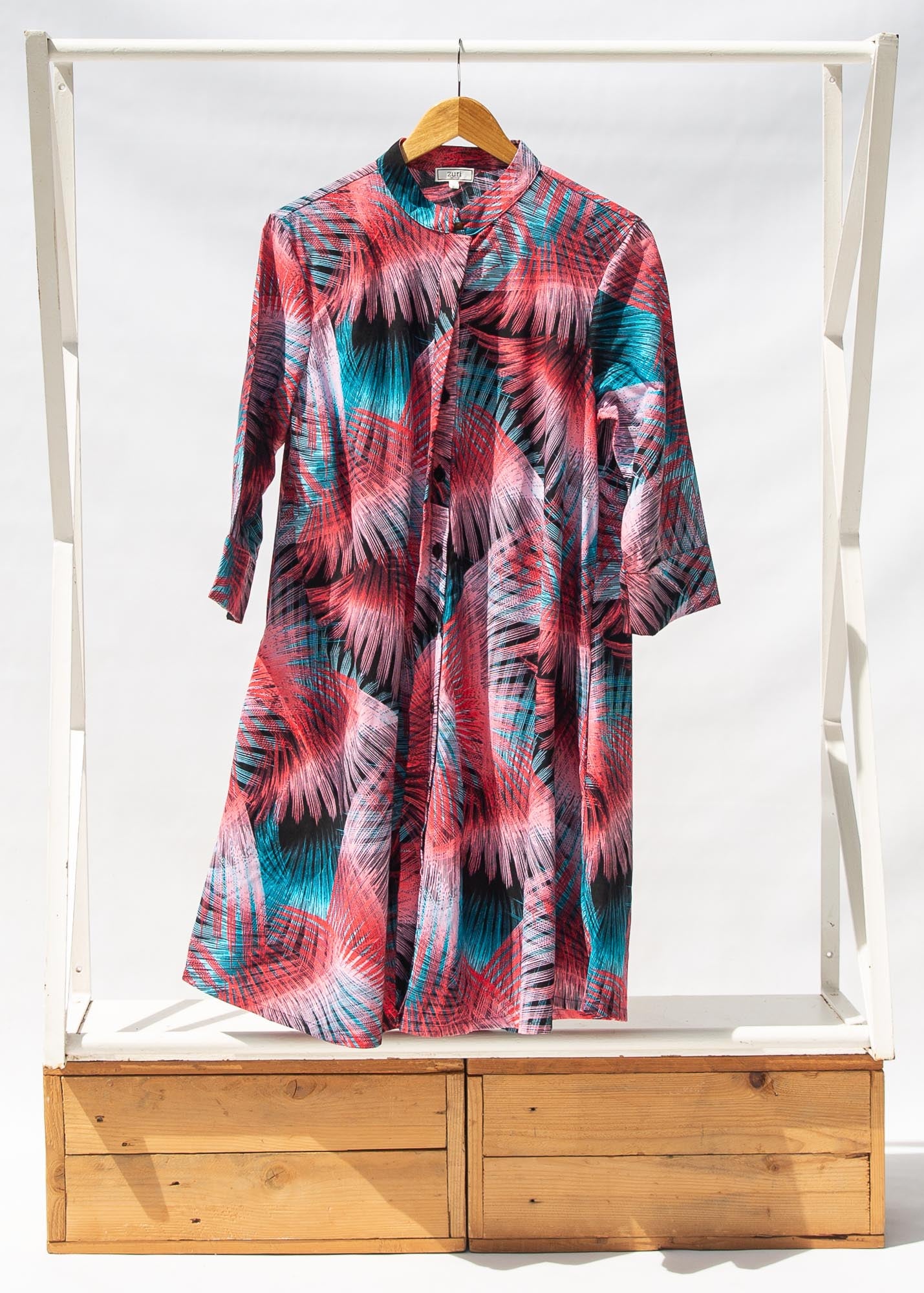 Display of black, red, pink, light blue print dress