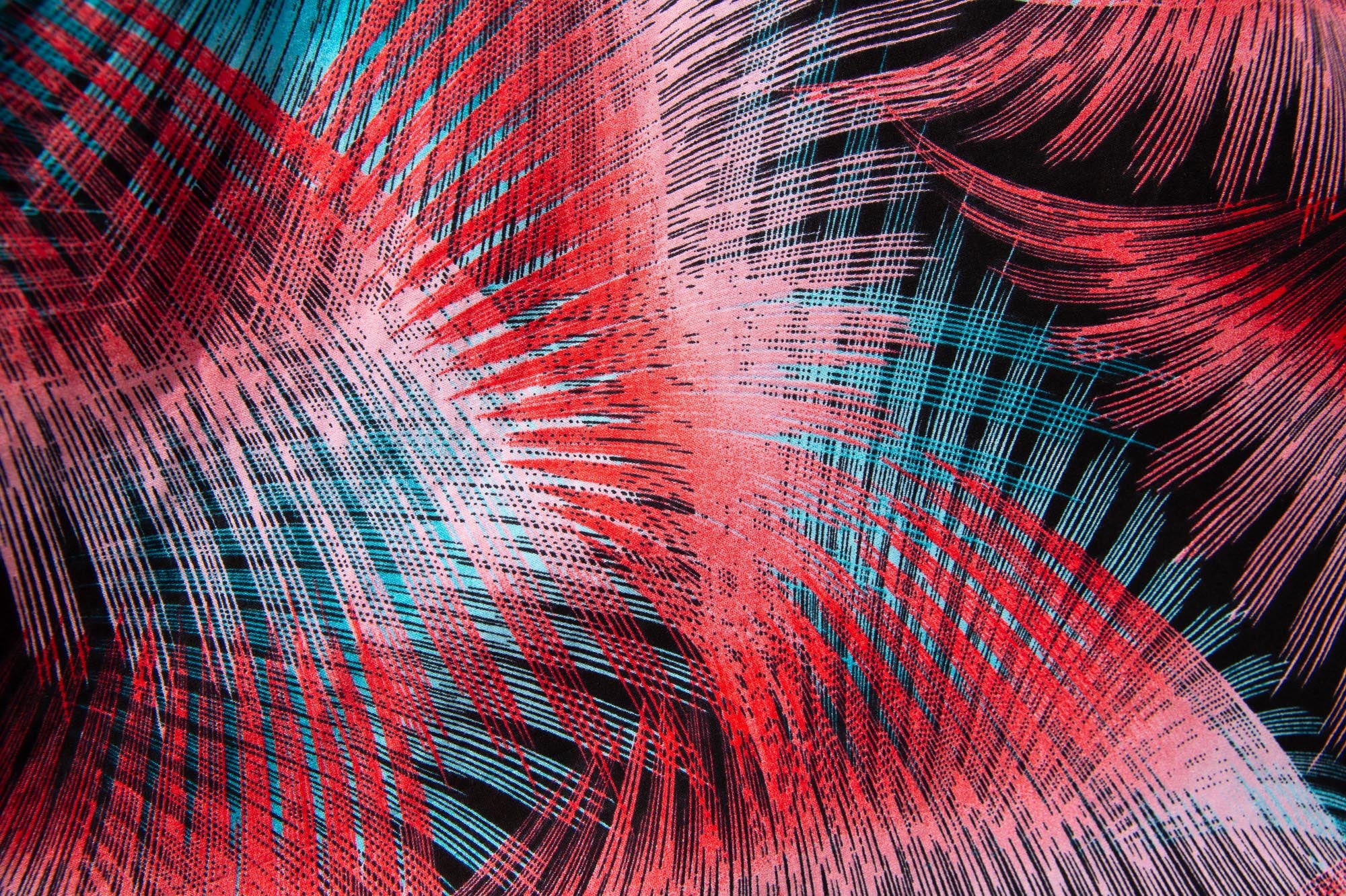 Close up display of black, red, pink, light blue print dress