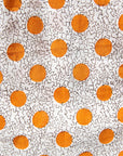 Close up display of white, orange, brown shirt