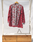 Display of red, black, white print shirt