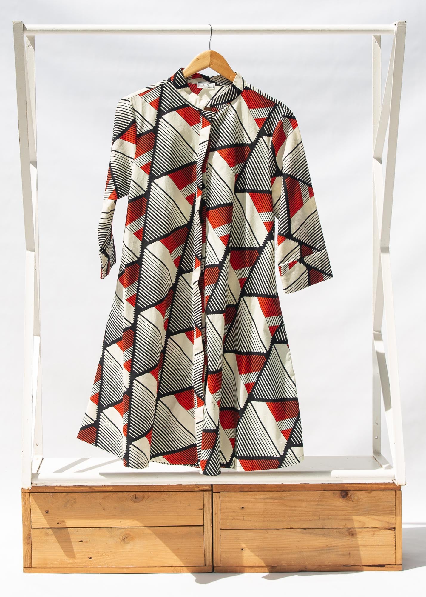 Display of black, red, off white print dress