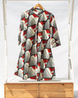 Display of black, red, off white print dress