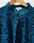 Display of blue and black print dress