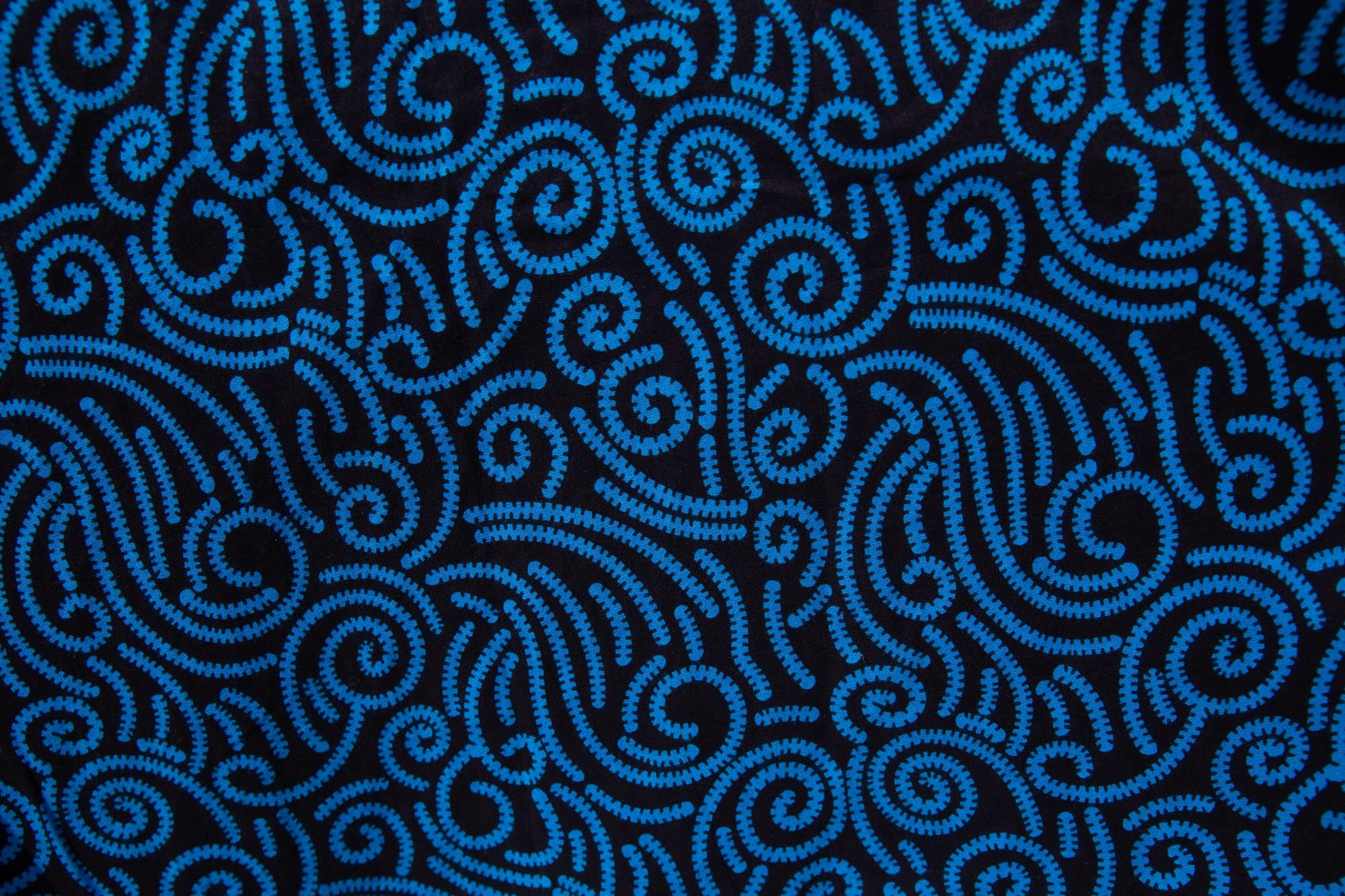 Close up display of blue and black print dress