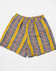 Display of olive-yellow, blue, orange and white geometric printed shorts