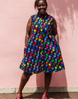 The model is wearing black dress with colorful panel