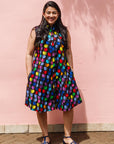 The model is wearing black dress with colorful panel