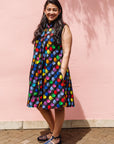 The model is wearing black dress with colorful panel