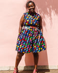 The model is wearing black dress with colorful panel