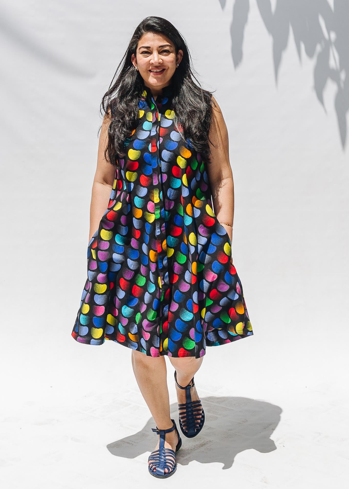 The model is wearing black dress with colorful panel