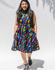 The model is wearing black dress with colorful panel