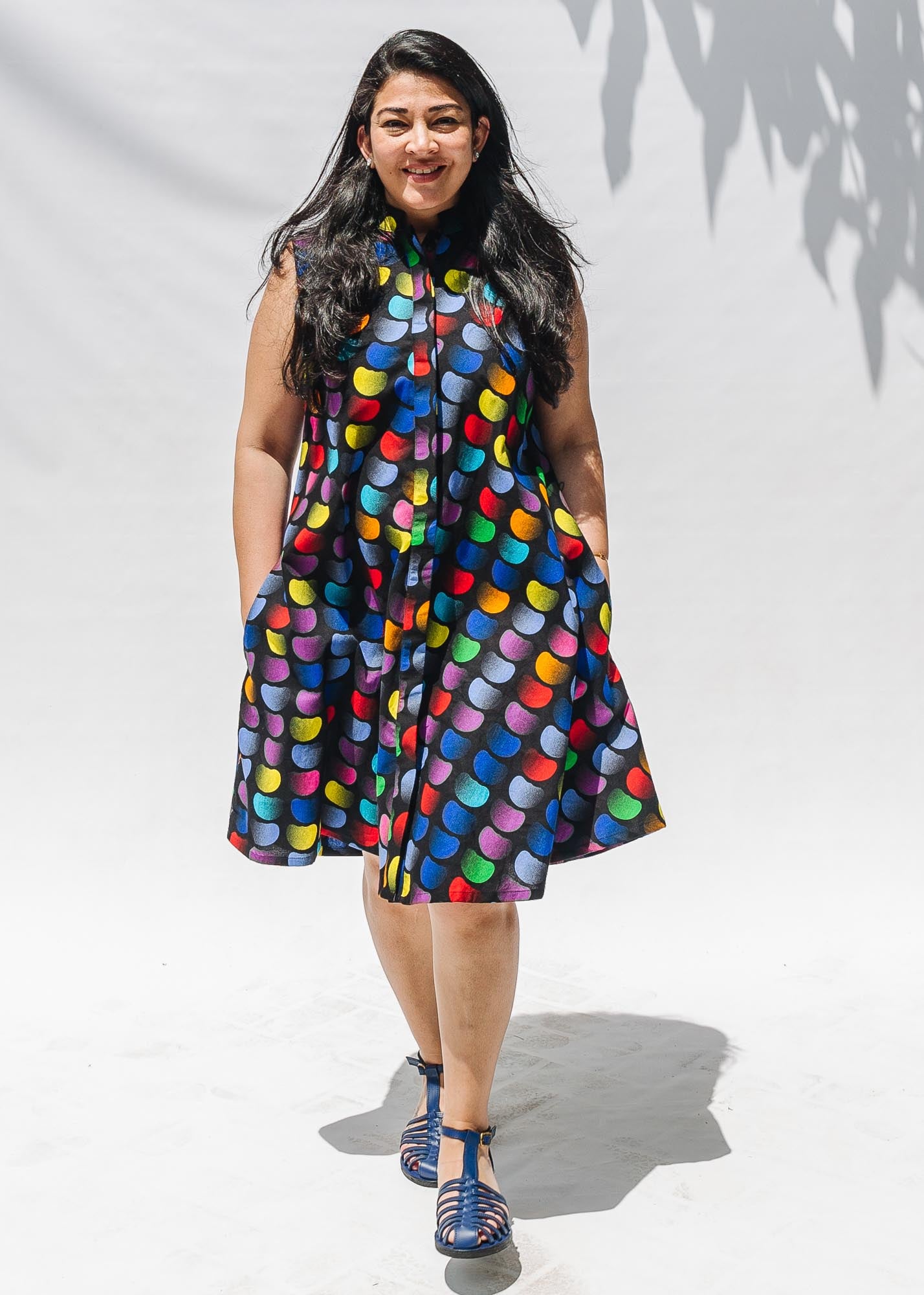 The model is wearing black dress with colorful panel