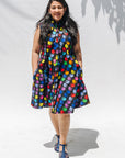 The model is wearing black dress with colorful panel