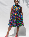 The model is wearing black dress with colorful panel