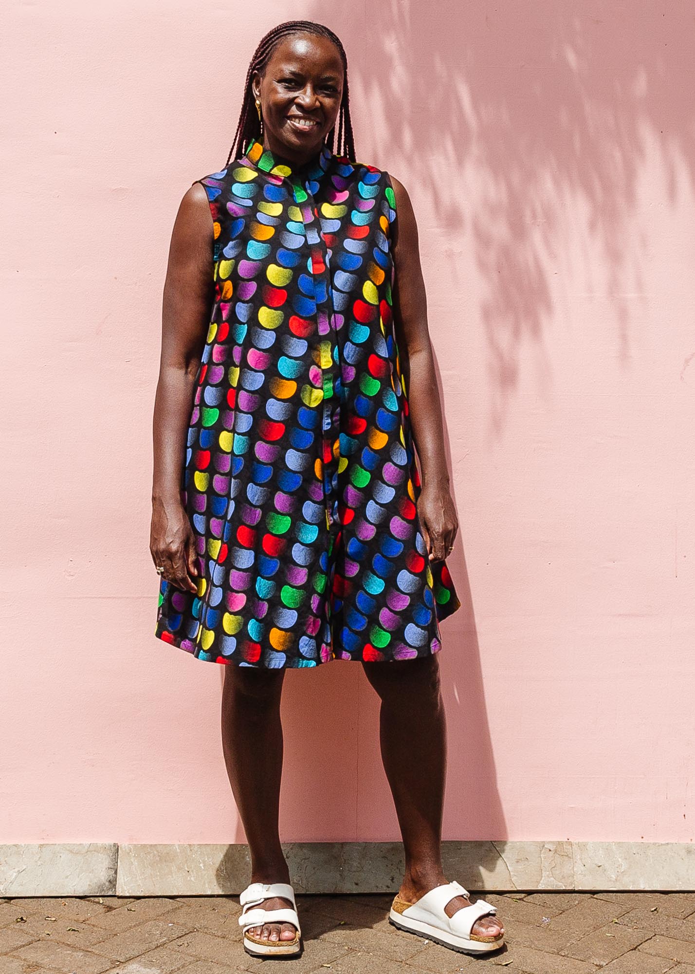 The model is wearing black dress with colorful panel