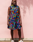 The model is wearing black dress with colorful panel