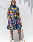 The model is wearing black dress with colorful panel