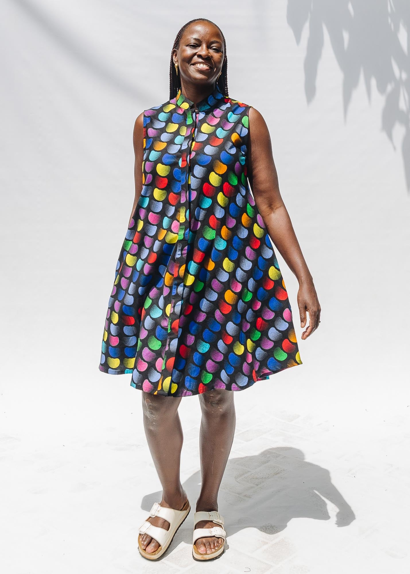 The model is wearing black dress with colorful panel