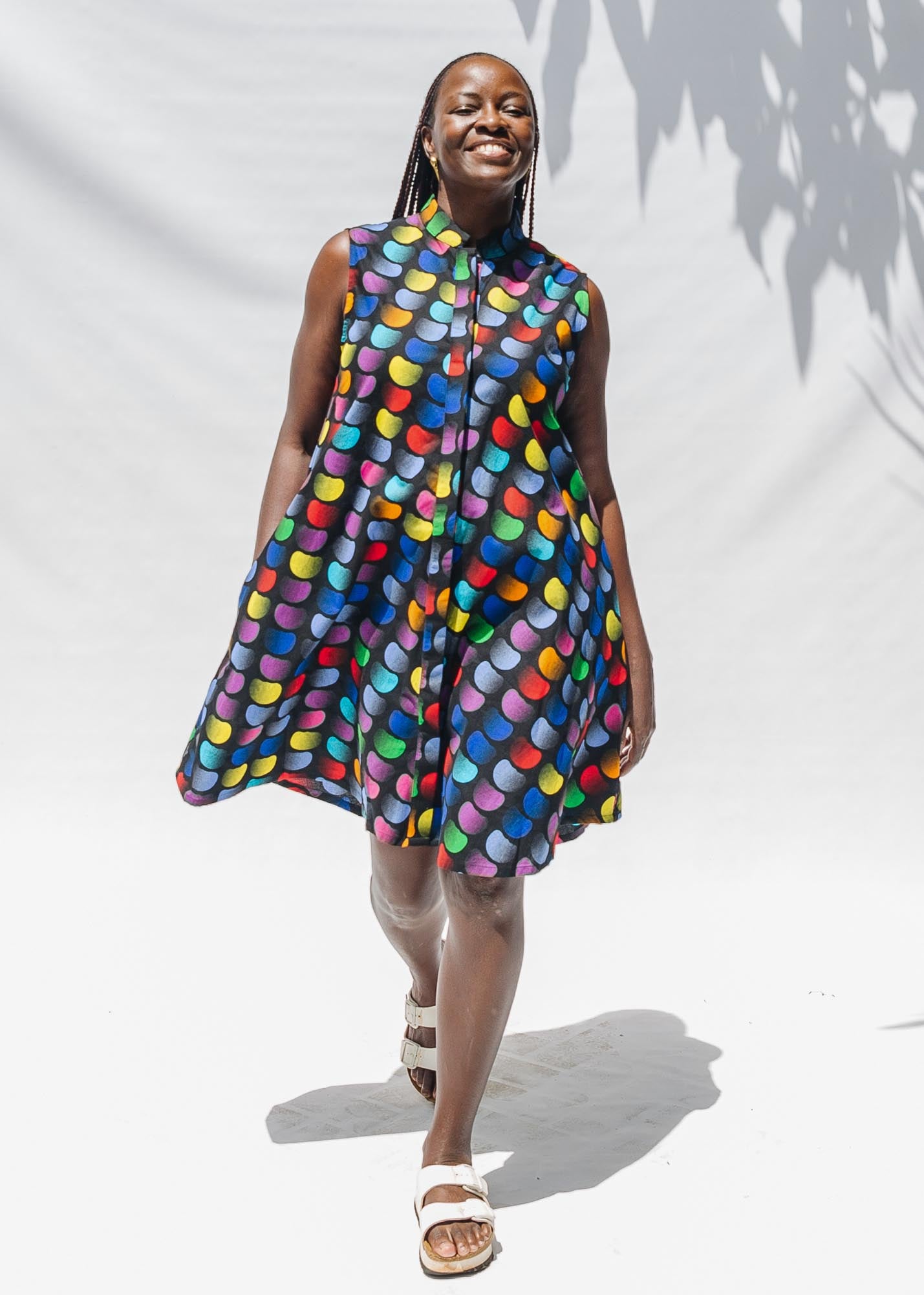 The model is wearing black dress with colorful panel