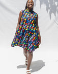 The model is wearing black dress with colorful panel