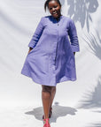 The model is wearing lavender dress