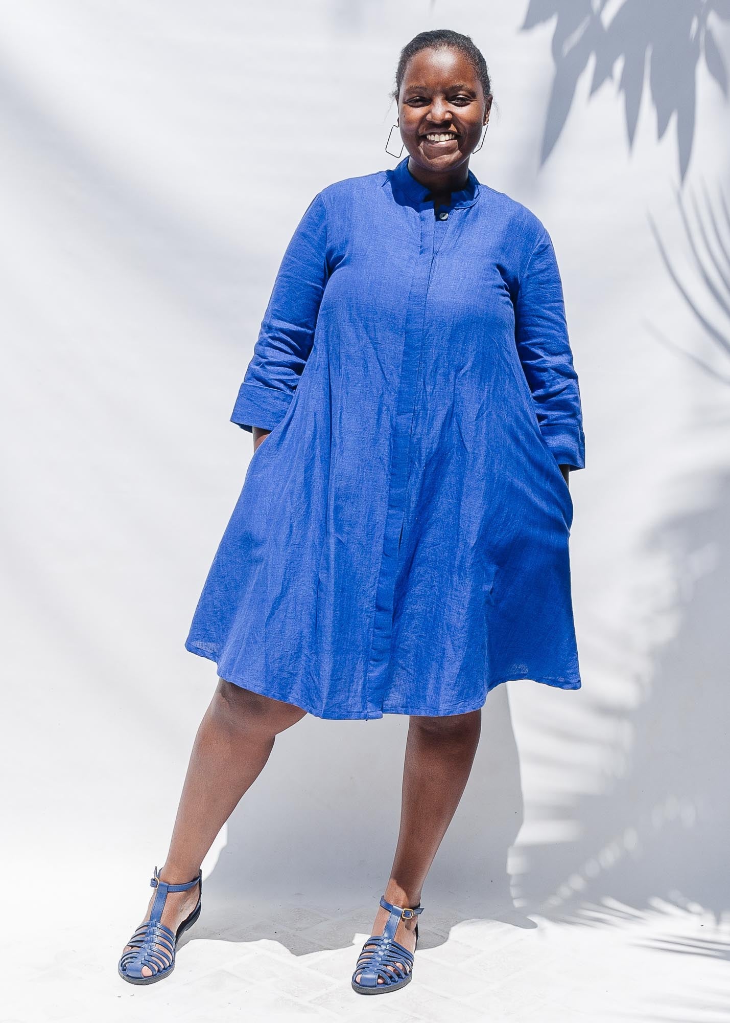 The model is wearing blue dress