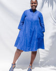 The model is wearing blue dress