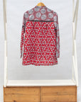 Display of red, black, white print shirt