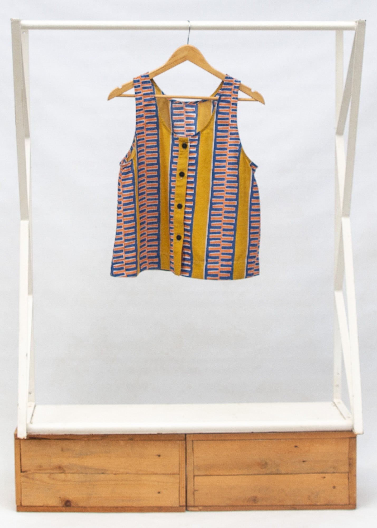 Display of olive-yellow, blue, orange and white geometric printed tank 