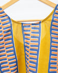 Close up display olive-yellow, blue, orange and white geometric printed tank