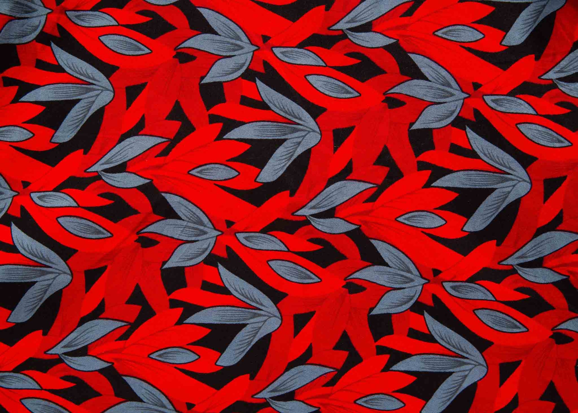 Display of red, black and gray leaf print dress.