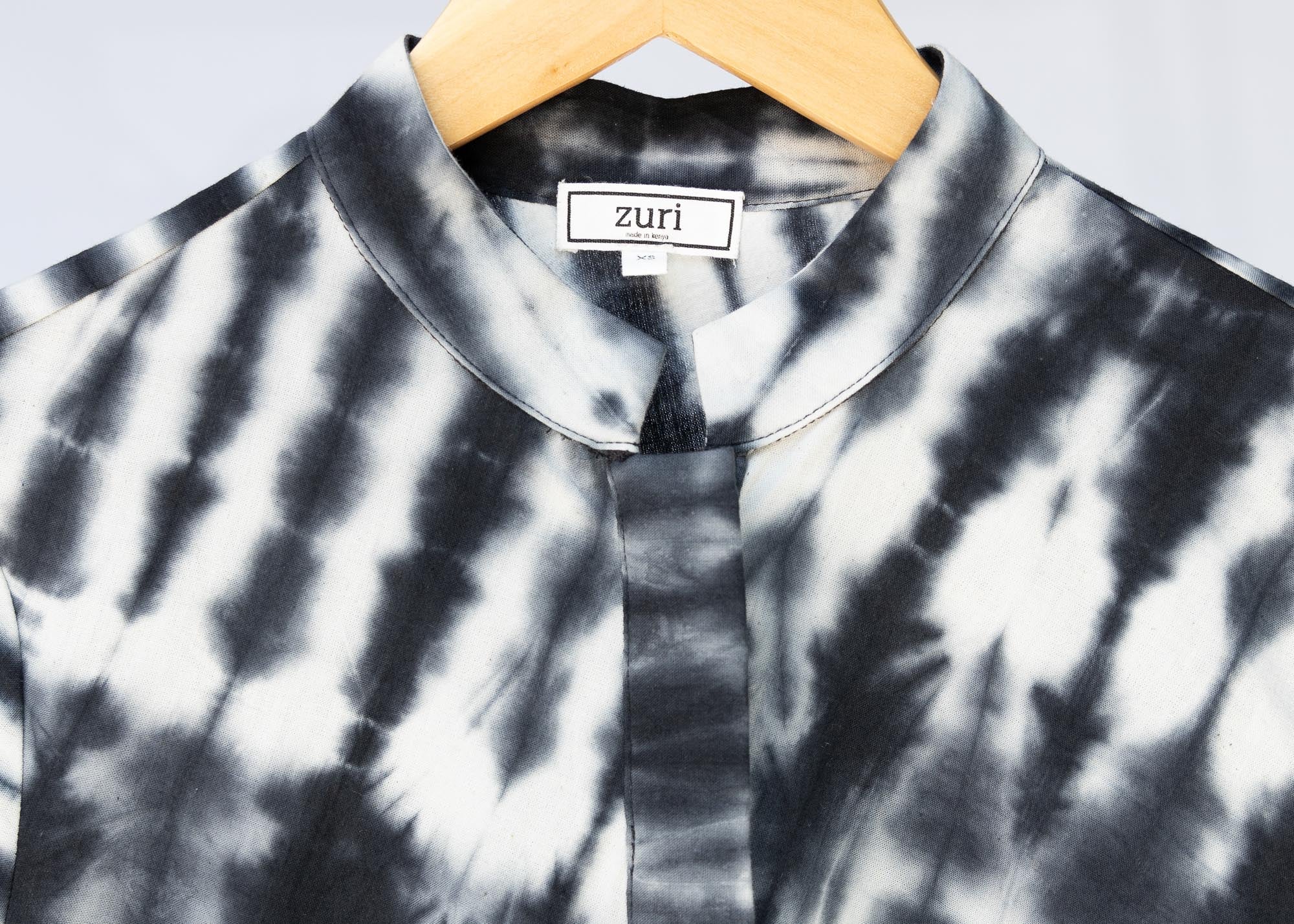 detail of slate grey and white tie-dye dress