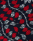 fabric detail of a red and navy leaf design