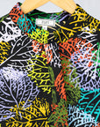 detail of a multicolor leaf design dress