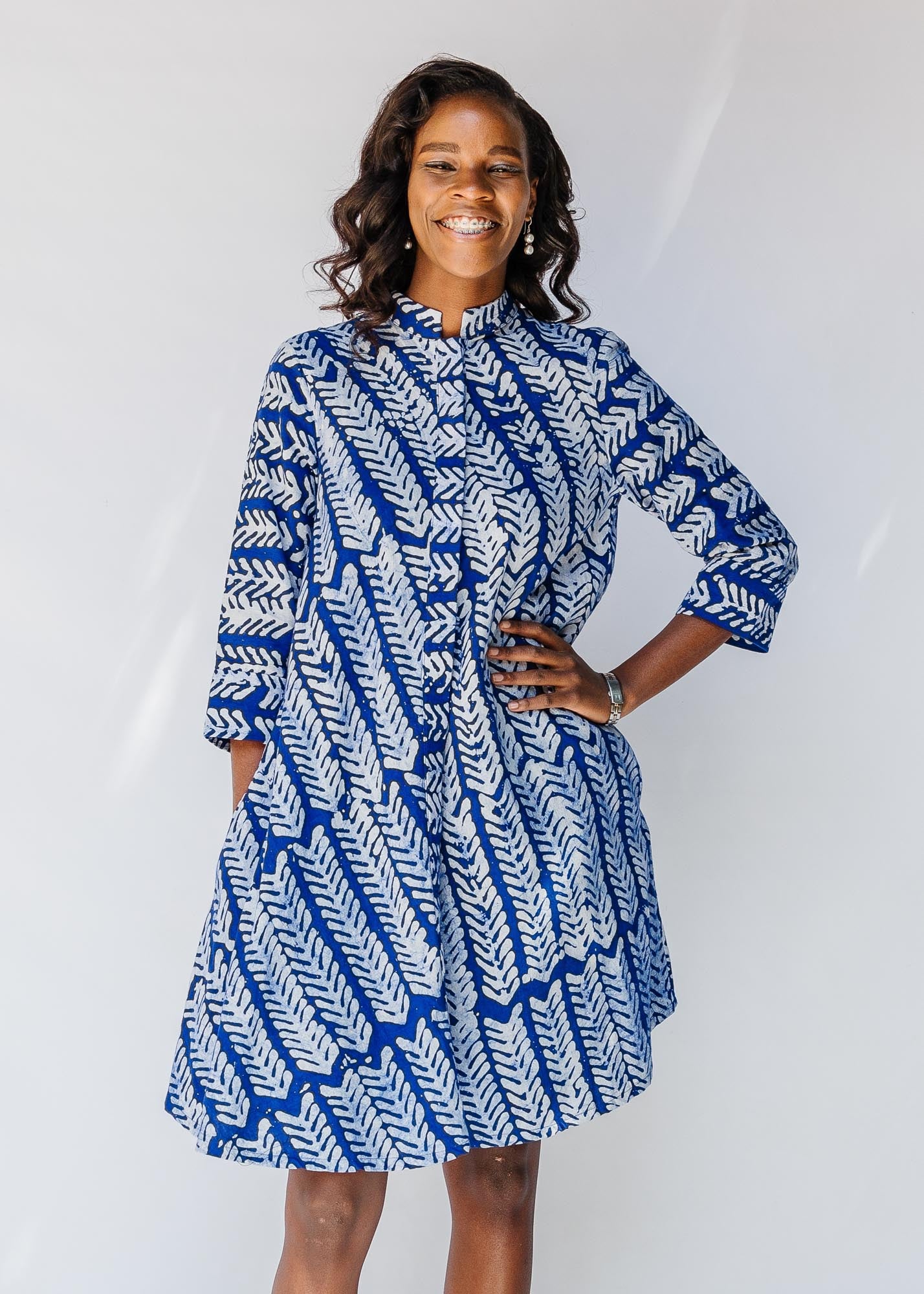 model wearing blue and white hand-blocked batik dress