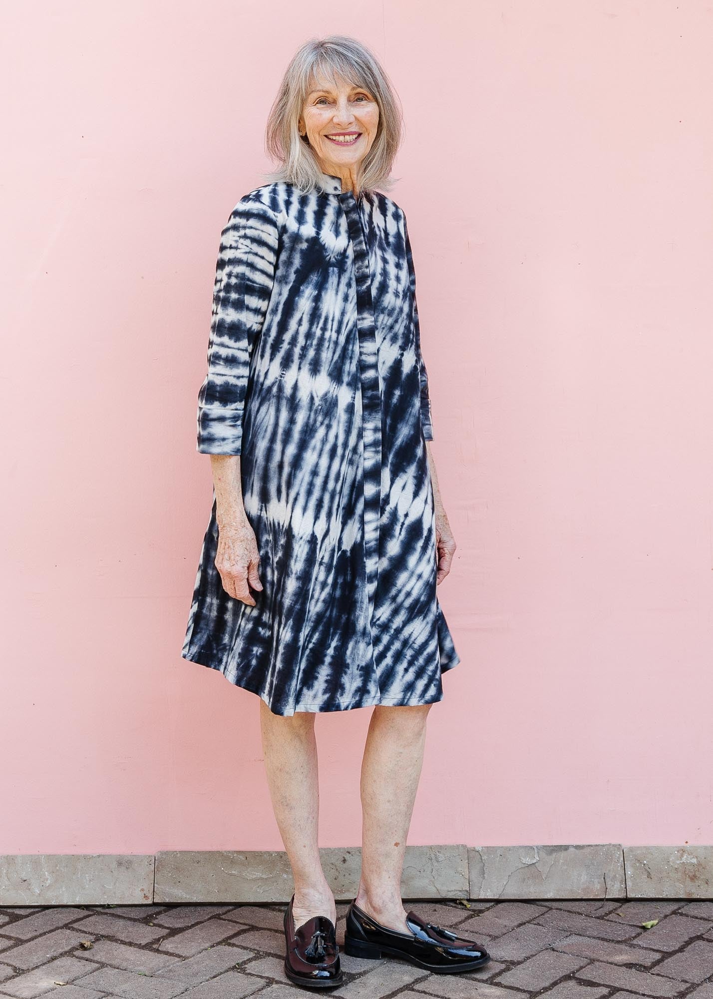 model wearing slate grey and white tie-dye dress