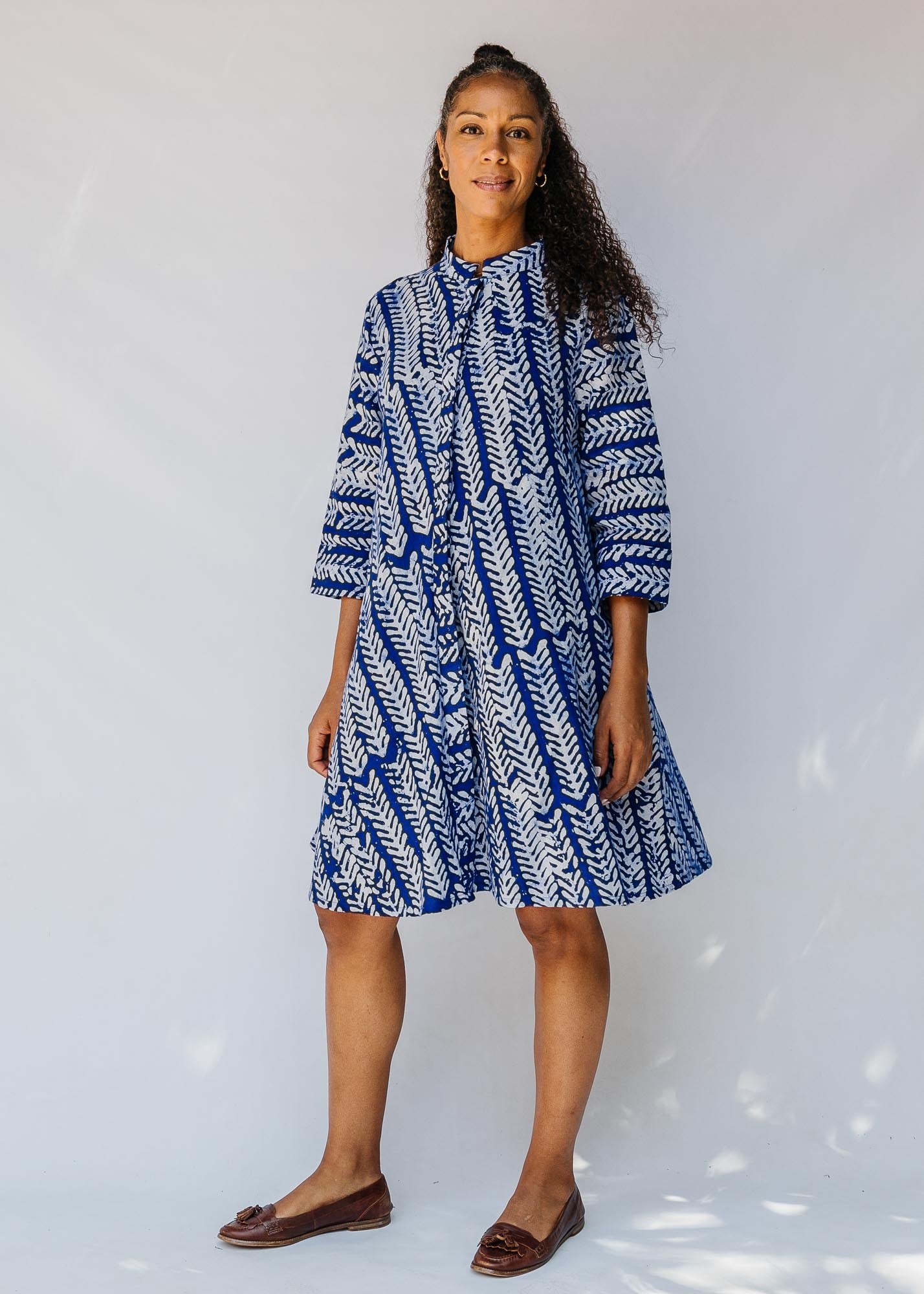 model wearing blue and white hand-blocked batik dress