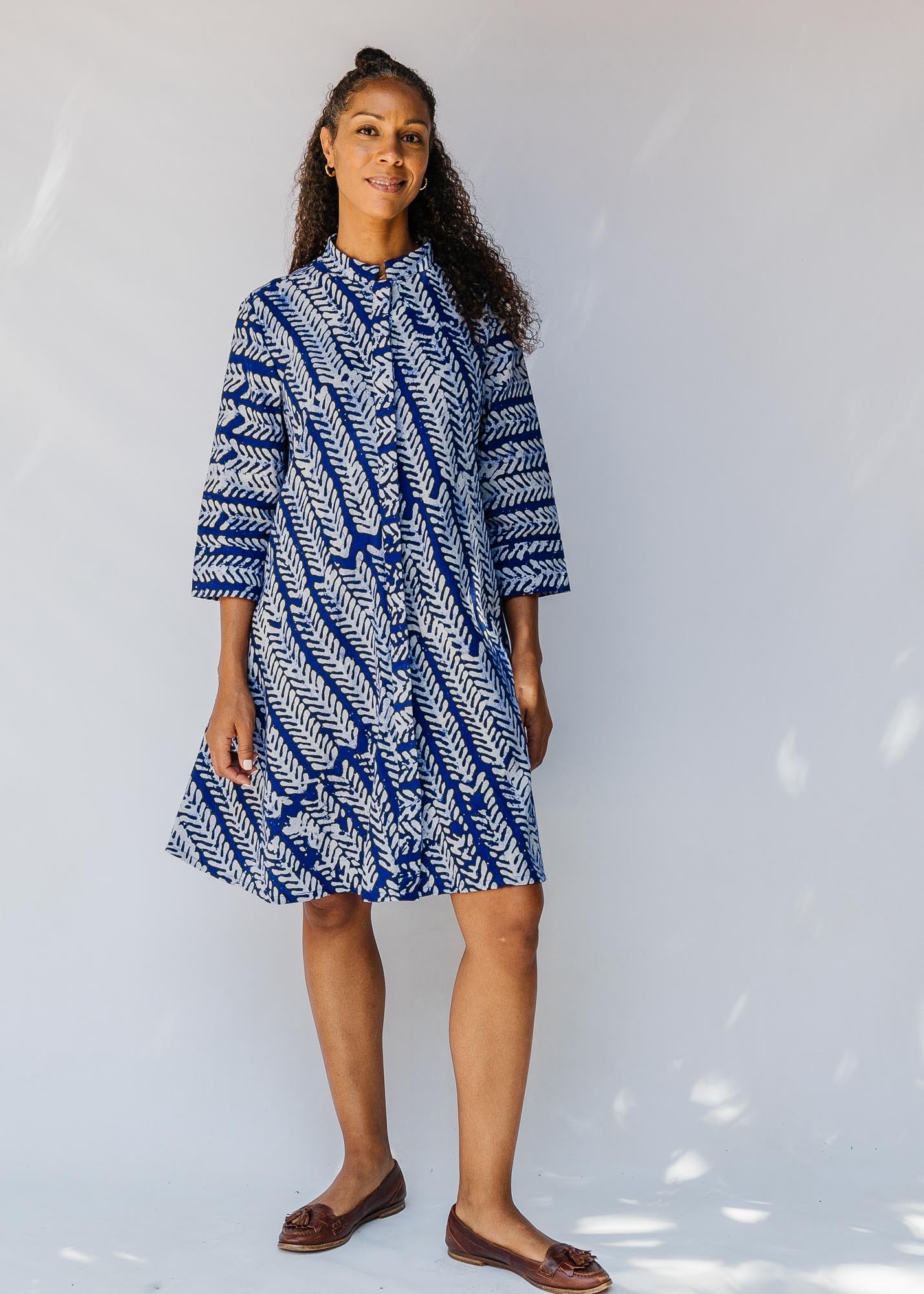 model wearing blue and white hand-blocked batik dress