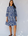 model wearing blue and white hand-blocked batik dress