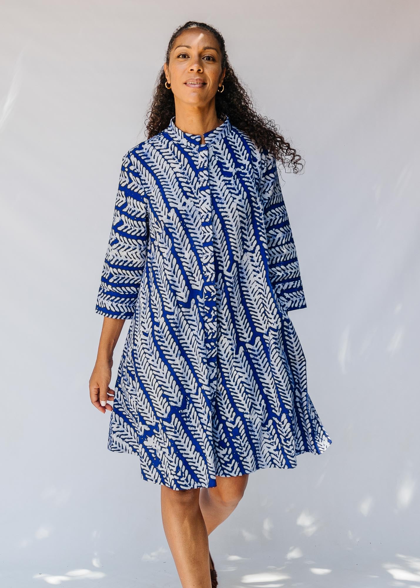 model wearing blue and white hand-blocked batik dress